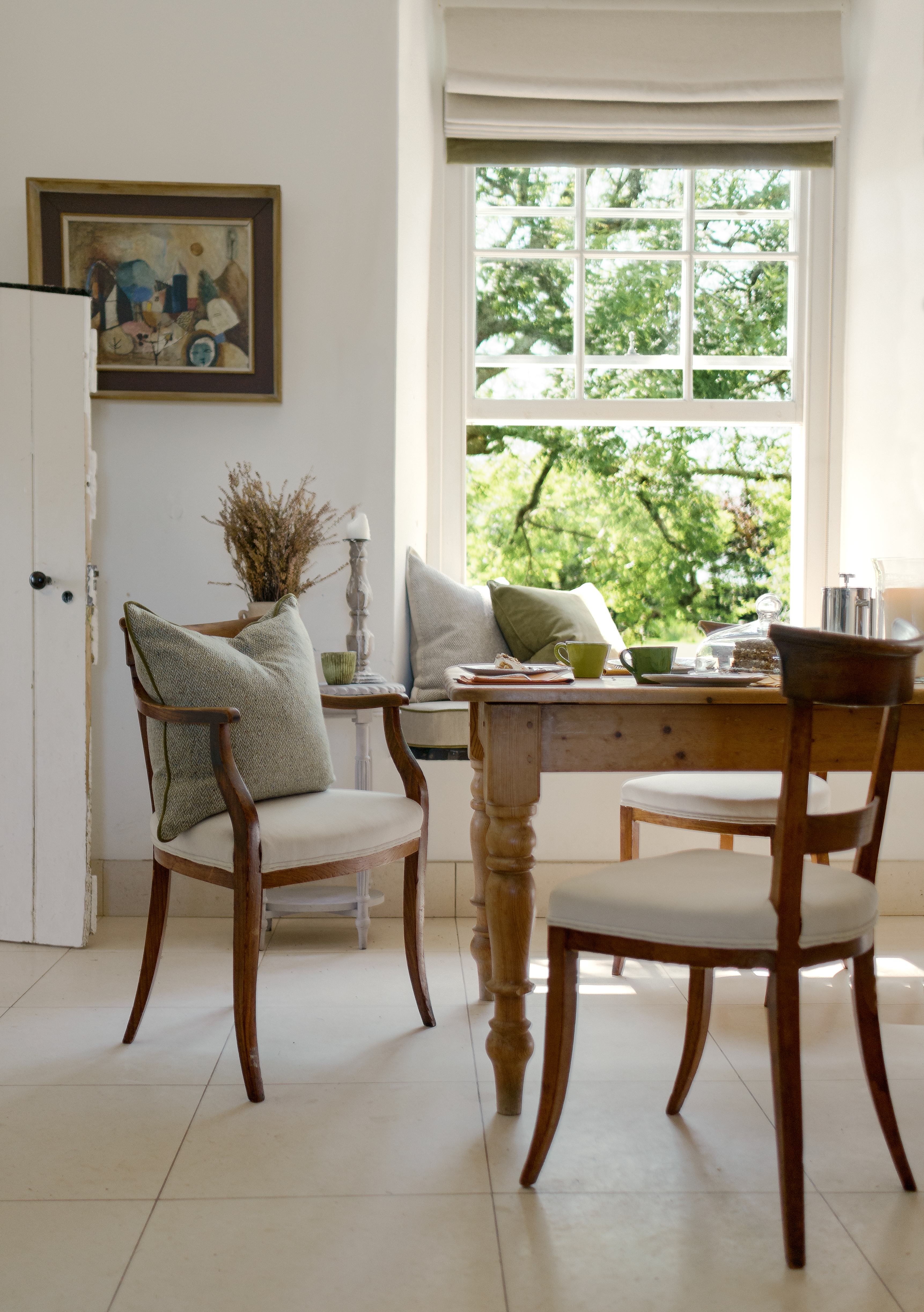 Luxury scatter cushions and bespoke blinds creating the perfect window seat