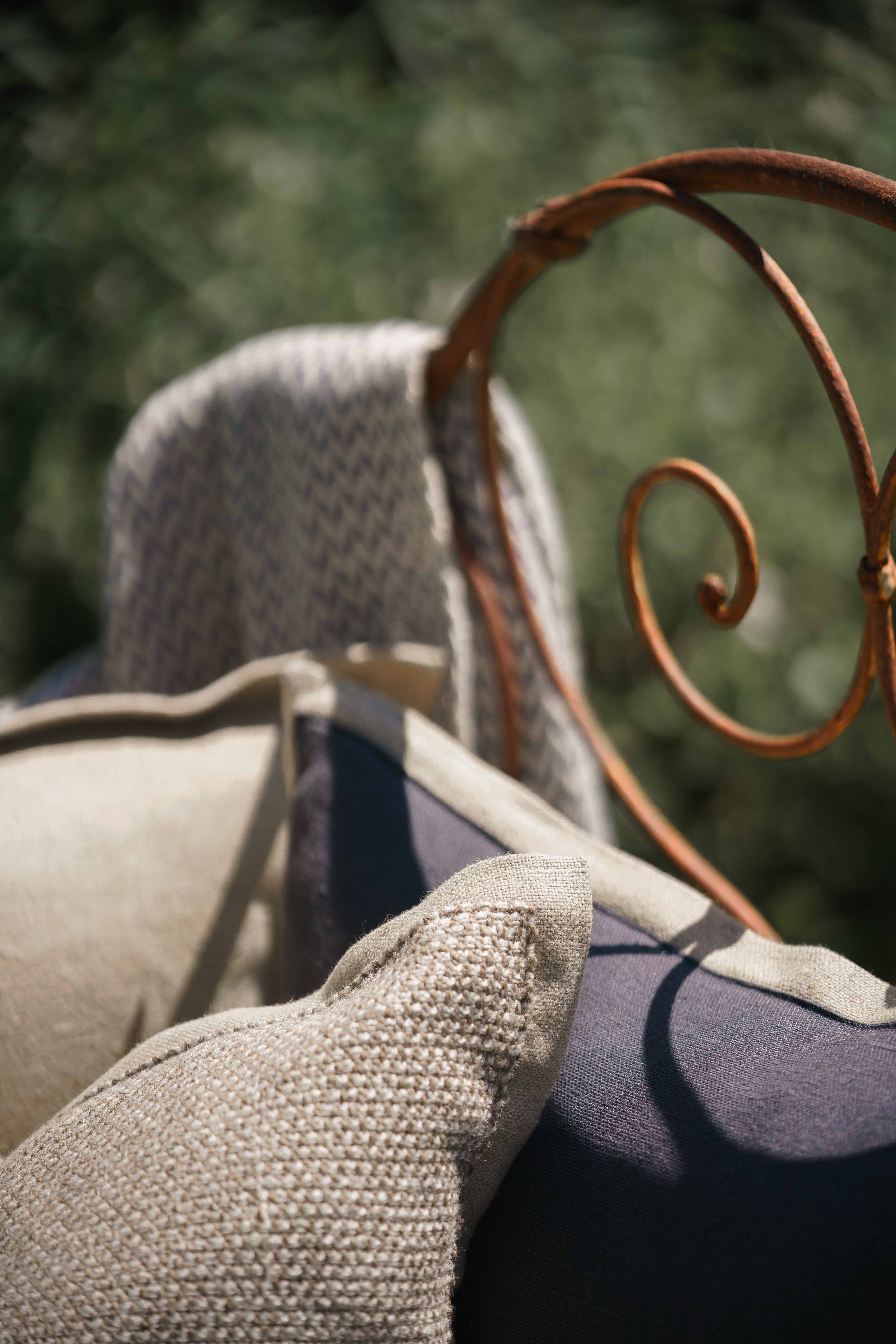 Made to measure cushions, placed in an outdoor area for comfort. 