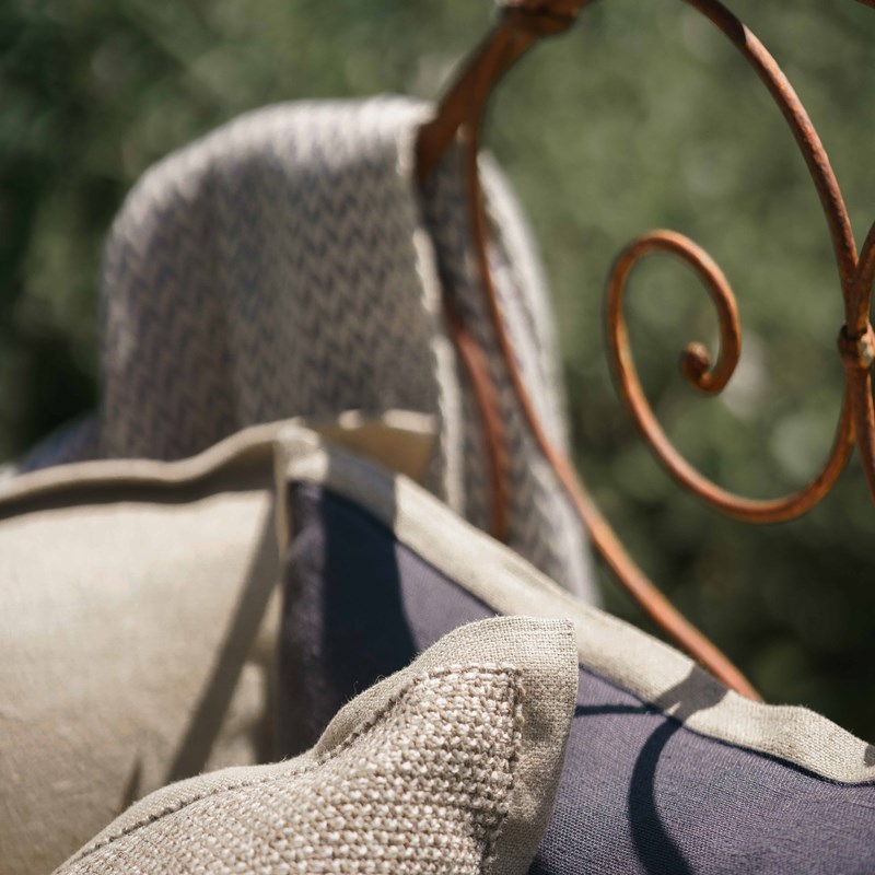 Made to measure cushions, placed in an outdoor area for comfort.