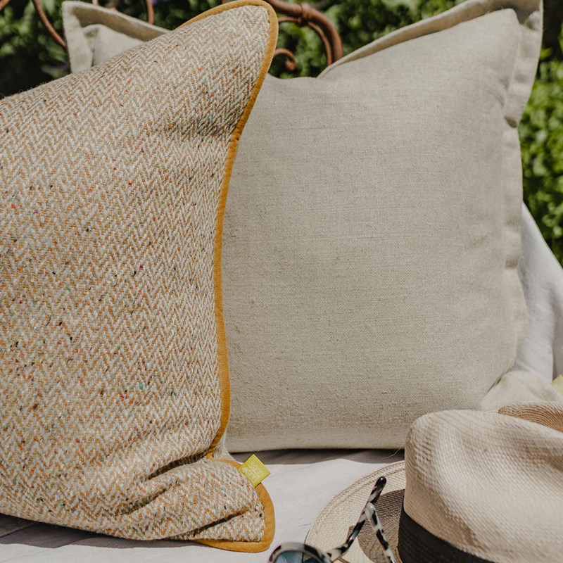 Herringbone cushions, styled in an outdoor space.