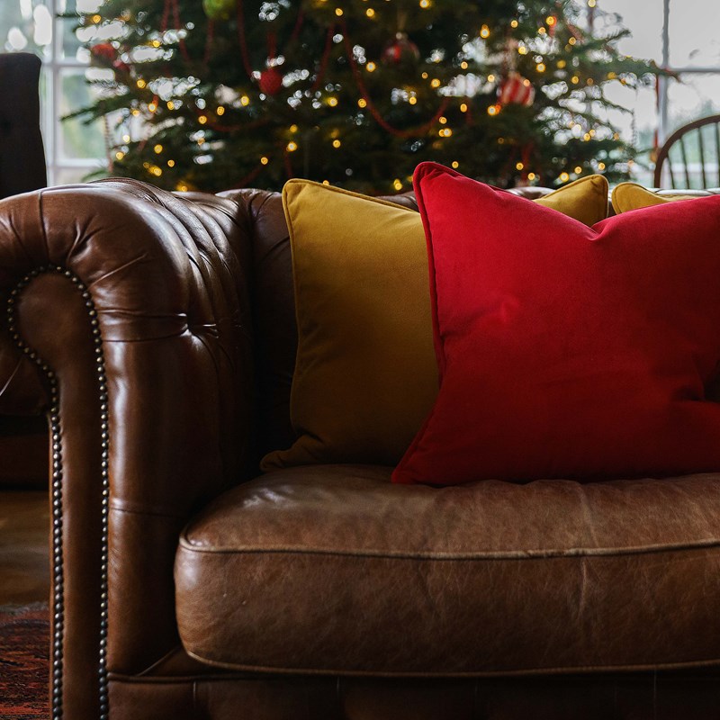 Luxury cushions in festive colours in our home interiors shop